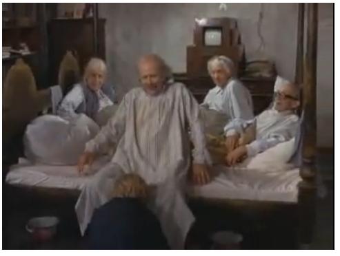 Dont get carried away, Charlie is helping Grandpa Joe with his slippers. Look at the headboard.